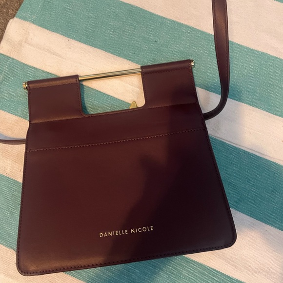 Elegant Brown and Gold Crossbody Bag with Flap Closure and Decorative Motif - Picture 2 of 5